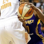 Los Angeles Sparks' Alana Beard (0) tries to get around Phoenix Mercury's DeWanna Bonner (24) during the first half of Game 2 of a WNBA basketball Western Conference semifinal series, Saturday, Sept. 21, 2013, in Phoenix. (AP Photo/Matt York)