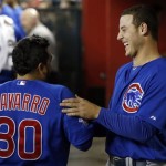 Chicago Cubs' Dioner Navarro (30) celebrates with teammate Anthony Rizzo after Navarro's home run against the Arizona Diamondbacks in the second inning of a baseball game on Monday, July 22, 2013, in Phoenix. (AP Photo/Ross D. Franklin)