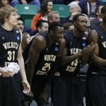 Wichita State players from left, Ron Baker, Ehimen Orukpe, Nick Wiggins and Chadrack Lufile, celebrate on the sideline during the second half of a second-round game in the NCAA college basketball tournament against Pittsburgh Thursday, March 21, 2013, in Salt Lake City Wichita State won 73-55. (AP Photo/George Frey)