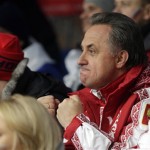 Vitaly Mutko, head of Ministries and Agencies with the Russian government, cheers his team's sleds during the men's two-man bobsled competition at the 2014 Winter Olympics, Monday, Feb. 17, 2014, in Krasnaya Polyana, Russia. (AP Photo/Jae C. Hong)

