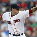 Boston Red Sox's Jake Peavy pitches in the first inning of a baseball game against the Arizona Diamondbacks in Boston, Saturday, Aug. 3, 2013. (AP Photo/Michael Dwyer)
