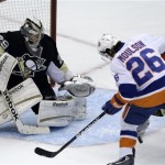 New York Islanders' Matt Moulson (26) can't get his stick on a rebound in front of Pittsburgh Penguins goalie Marc-Andre Fleury (29) during the first period of Game 1 of an NHL hockey Stanley Cup first-round playoff series, Wednesday, May 1, 2013, in Pittsburgh. (AP Photo/Gene J. Puskar)