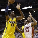Indiana Pacers center Roy Hibbert (55) shoots under the defense of Miami Heat power forward Udonis Haslem (40) during the first half of Game 7 in their NBA basketball Eastern Conference finals playoff series, Monday, June 3, 2013 in Miami. (AP Photo/Lynne Sladky)