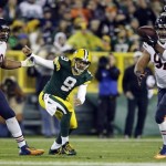 Green Bay Packers quarterback Seneca Wallace watches as Chicago Bears' Julius Peppers (90) intercepts a pass during the first half of an NFL football game Monday, Nov. 4, 2013, in Green Bay, Wis. (AP Photo/Jeffrey Phelps)