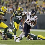 Green Bay Packers' Jerron McMillian (22) breaks away during the first half of an NFL football game against the Green Bay Packers Monday, Nov. 4, 2013, in Green Bay, Wis. (AP Photo/Mike Roemer)