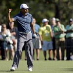 Tiger Woods reacts to his approach shot to the 15th green during the third round of the Masters golf tournament Saturday, April 13, 2013, in Augusta, Ga. (AP Photo/David Goldman)
