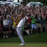 Adam Scott, of Australia, celebrates after making a birdie putt on the second playoff hole to win the Masters golf tournament Sunday, April 14, 2013, in Augusta, Ga. (AP Photo/David J. Phillip)
