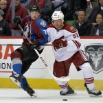  Phoenix Coyotes defenseman Derek Morris (53) tangles with Colorado Avalanche center John Mitchell (7) during the third period of an NHL hockey game on Friday, Feb. 28, 2014, in Denver. (AP Photo/Jack Dempsey)