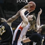 Gonzaga's Kelly Olynyk, center, is sandwiched between Wichita State's Carl Hall, left and Demetric Willimas during the first half of a third-round game in the NCAA men's college basketball tournament in Salt Lake City on Saturday, March 23, 2013. (AP Photo/George Frey)
