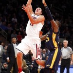  Arizona's Aaron Gordon, left, shoots against Drexel's Mohamed Bah, right, during the first half of an NCAA college basketball game in the semifinals of the NIT Season Tip-off tournament Wednesday, Nov. 27, 2013, in New York. (AP Photo/Jason DeCrow)
