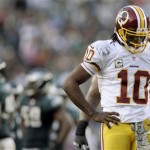 Washington Redskins quarterback Robert Griffin III walks across the field after a play during the second half of an NFL football game against the Philadelphia Eagles in Philadelphia, Sunday, Nov. 17, 2013. (AP Photo/Michael Perez)