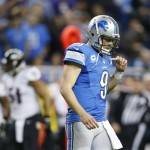 Detroit Lions quarterback Matthew Stafford (9) walks off the field after Baltimore Ravens free safety Matt Elam (26) intercepted his pass during the fourth quarter of an NFL football game in Detroit, Monday, Dec. 16, 2013. (AP Photo/Rick Osentoski)