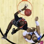 Cincinnati's Cheikh Mbodj, left, goes up for a shot against Creighton's Gregory Echenique during the first half of a second-round game of the NCAA college basketball tournament, Friday, March 22, 2013, in Philadelphia. (AP Photo/Matt Slocum)