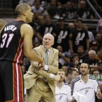 San Antonio Spurs' Gregg Popovich and the bench react as the Miami Heat's Shane Battier (31) passes during the first half at Game 5 of the NBA Finals basketball series, Sunday, June 16, 2013, in San Antonio. (AP Photo/Eric Gay)