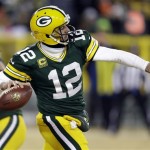  Green Bay Packers quarterback Aaron Rodgers (12) throws a pass during the second half of an NFL wild-card playoff football game against the San Francisco 49ers, Sunday, Jan. 5, 2014, in Green Bay, Wis. (AP Photo/Mike Roemer)