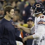 Chicago Bears quarterback Josh McCown (12) talks to Jay Cutler during the first half of an NFL football game against the Green Bay Packers Monday, Nov. 4, 2013, in Green Bay, Wis. (AP Photo/Mike Roemer)