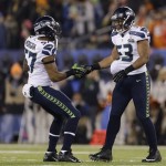 Seattle Seahawks' Malcolm Smith (53) celebrates with teammate Mike Morgan recovering a fumble during the second half of the NFL Super Bowl XLVIII football game against the Denver Broncos Sunday, Feb. 2, 2014, in East Rutherford, N.J. (AP Photo/Jeff Roberson)