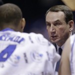 Duke head coach Mike Krzyzewski talks to guard Rasheed Sulaimon (14) during a time out in the second half of a regional semifinal in the NCAA college basketball tournament, Friday, March 29, 2013, in Indianapolis. (AP Photo/Michael Conroy)