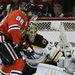Chicago Blackhawks right wing Patrick Kane (88) scores against Boston Bruins goalie Tuukka Rask (40) in the second period during Game 5 of the NHL hockey Stanley Cup Finals, Saturday, June 22, 2013, in Chicago. (AP Photo/Nam Y. Huh)
