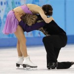 Meryl Davis and Charlie White of the United States embrace after completing their routine in the ice dance free dance figure skating finals at the Iceberg Skating Palace during the 2014 Winter Olympics, Monday, Feb. 17, 2014, in Sochi, Russia. The couple would go on to win the United States' first-ever gold medal in the event. (AP Photo/Vadim Ghirda)