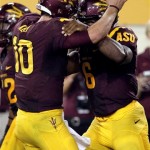 Arizona State quarterback Taylor Kelly, left, congratulates teammate Cameron Marshall, right, after Marshall scored a touchdown against Utah in the second quarter of an NCAA college football game, Saturday, Sept. 22, 2012, in Tempe, Ariz. (AP Photo/Paul Connors)
