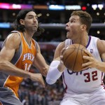 Los Angeles Clippers' Blake Griffin, right, looks to shoot against Phoenix Suns' Luis Scola, of Argentina, in the first half of an NBA basketball game in Los Angeles, Saturday, Dec. 8, 2012. The Clippers won 117-99. (AP Photo/Jae C. Hong)
