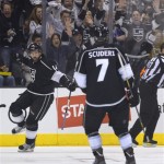 Los Angeles Kings right wing Justin Williams (14) celebrates in front of defenseman Rob Scuderi (7) after scoring a goal against the Chicago Blackhawks during the first period in Game 3 of the NHL hockey Stanley Cup playoffs Western Conference finals, Tuesday, June 4, 2013, in Los Angeles. (AP Photo/Mark J. Terrill)