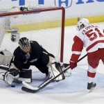Anaheim Ducks goalie Jonas Hiller, right, blocks a shot by Detroit Red Wings center Valtteri Filppula during the first period in Game 1 of their first-round NHL hockey Stanley Cup playoff series in Anaheim, Calif., Tuesday, April 30, 2013. (AP Photo/Chris Carlson