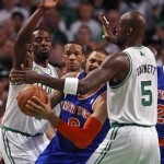 New York Knicks center Tyson Chandler, center, is trapped between Boston Celtics center Kevin Garnett (5) and forward Jeff Green, left, during Game 6 of their first-round NBA basketball playoff series in Boston, Friday, May 3, 2013. (AP Photo/Charles Krupa