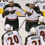 Minnesota Wild's Jared Spurgeon (46) celebrates his goal against the Phoenix Coyotes with teammates Ryan Suter (20), Kyle Brodziak (21), Mikko Koivu (9), of Finland, and Zach Parise (11) during the second period in an NHL hockey game, Thursday, Feb. 28, 2013, in Glendale, Ariz. (AP Photo/Ross D. Franklin)