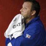 Toronto Blue Jays' Mark Buehrle wipes sweat from his face as he sits in the dugout after pitching the fifth inning of a baseball game against the Arizona Diamondbacks, Wednesday, Sept. 4, 2013, in Phoenix. (AP Photo/Ross D. Franklin)