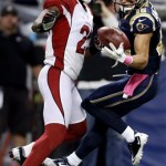 St. Louis Rams wide receiver Danny Amendola, right, catches a 44-yard pass as Arizona Cardinals cornerback Patrick Peterson defends during the first quarter of an NFL football game, Thursday, Oct. 4, 2012, in St. Louis. (AP Photo/Jeff Roberson)