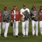 Members of the St. Louis Cardinals bullpen walk back to the dugout after Game 4 of baseball's National League championship series against the San Francisco Giants Thursday, Oct. 18, 2012, in St. Louis. The Cardinals won 8-3 to take a 3-1 lead in the series. (AP Photo/Patrick Semansky)