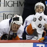 New York Islanders' Marty Reasoner (16) and Travis Hamonic (3) sit on the bench during the third period of Game 1 of an NHL hockey Stanley Cup first-round playoff series against the Pittsburgh Penguins, Wednesday, May 1, 2013, in Pittsburgh. The Penguins won 5-0. (AP Photo/Gene J. Puskar)