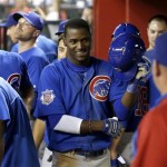Chicago Cubs' Junior Lake smiles after celebrating in the dugout after hitting his two-run home run against the Arizona Diamondbacks in the fifth inning of a baseball game on Monday, July 22, 2013, in Phoenix. (AP Photo/Ross D. Franklin)