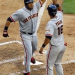 San Francisco Giants' Melky Cabrera celebrates his two-run home run with Angel Pagan (16) during the fifth inning of an opening day baseball game against the Arizona Diamondbacks, Friday, April 6, 2012, in Phoenix. (AP Photo/Matt York)