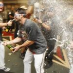 Arizona Diamondbacks players celebrate in the 
locker room after an MLB baseball game against 
the San Francisco Giants, Friday, Sept. 23, 
2011, in Phoenix. The Diamondbacks defeated the 
Giants 3-1 and won the 2011 National League 
West Champions title. (AP Photo/Ross D. 
Franklin)