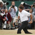 Phil Mickelson of the United States runs with the Claret Jug trophy after winning the British Open Golf Championship at Muirfield, Scotland, Sunday, July 21, 2013.(AP Photo/Matt Dunham)