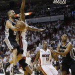 San Antonio Spurs point guard Tony Parker (9) shoots against Miami Heat center Chris Bosh (1) during the first half of Game 2 of the NBA Finals basketball game, Sunday, June 9, 2013 in Miami. (AP Photo/Lynne Sladky)