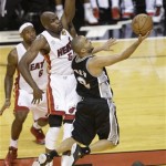 San Antonio Spurs point guard Tony Parker (9) shoots against Miami Heat center Joel Anthony (50) during the first half of Game 1 of basketball's NBA Finals, Thursday, June 6, 2013 in Miami. (AP Photo/Wilfredo Lee)