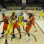 Michigan's Mitch McGary (4) vies for a rebound against Syracuse during the first half of the NCAA Final Four tournament college basketball semifinal game Saturday, April 6, 2013, in Atlanta. (AP Photo/NCAA Photos, Chris Steppig, Pool)

