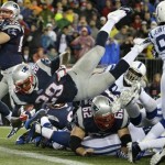 New England Patriots running back LeGarrette Blount (29) dives into the end zone for a touchdown during the first half of an AFC divisional NFL playoff football game against the Indianapolis Colts in Foxborough, Mass., Saturday, Jan. 11, 2014. (AP Photo/Matt Slocum)
