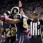 St. Louis Rams tight end Lance Kendricks is congratulated by Daryl Richardson, left, after catching a 7-yard pass for a touchdown during the first quarter of an NFL football game against the Arizona Cardinals, Thursday, Oct. 4, 2012, in St. Louis. (AP Photo/Tom Gannam)