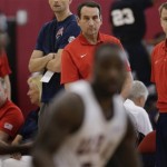 USA Basketball men's national team coach Mike Krzyzewski, left, watches a scrimmage with Steve Wojciechowski, director of player development and staffing, during USA mini camp practice, Monday, July 22, 2013, in Las Vegas. After leading Team USA to two straight Olympic gold medals, Krzyzewski will return to lead the Americans at the Rio Olympics in 2016 and will join Henry Iba as the only coaches in U.S. history to coach in three Olympics. (AP Photo/Julie Jacobson)