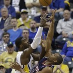 Indiana Pacers' Roy Hibbert, lefts, shoots against Atlanta Hawks' Al Horford during the first half of Game 1 in the first round of the NBA basketball playoffs on Sunday, April 21, 2013, in Indianapolis. (AP Photo/Darron Cummings)