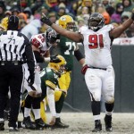 Atlanta Falcons' Corey Peters reacts after sacking Green Bay Packers quarterback Matt Flynn (10) during the first half of an NFL football game Sunday, Dec. 8, 2013, in Green Bay, Wis. (AP Photo/Mike Roemer)