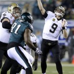 New Orleans Saints' Drew Brees (9) passes during the first half of an NFL wild-card playoff football game against the Philadelphia Eagles, Saturday, Jan. 4, 2014, in Philadelphia. (AP Photo/Michael Perez)