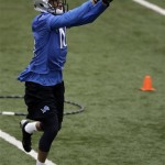 Detroit Lions wide receiver Tim Fuller makes a catch during NFL football rookie minicamp at their team's training facility in Allen Park, Mich., Saturday, May 11, 2013. (AP Photo/Carlos Osorio)
