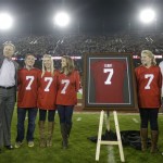  Former Stanford quarterback John Elway, left, gives a thumbs-up as he stands with his family during a ceremony to retire his jersey number during halftime of an NCAA college football game between Stanford and Oregon in Stanford, Calif., Thursday, Nov. 7, 2013. (AP Photo/Marcio Jose Sanchez)