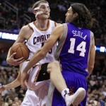 Cleveland Cavaliers' Tyler Zeller, left, gets a rebound ahead of Phoenix Suns' Luis Scola during the second quarter of an NBA basketball game Tuesday, Nov. 27, 2012, in Cleveland. (AP Photo/Tony Dejak)